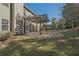 Expansive backyard featuring a covered patio with a wooden pergola and well-maintained lawn at 4950 Luke Dr, Cumming, GA 30040