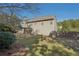 Well-maintained backyard with a pergola-covered patio and ample green space at 4950 Luke Dr, Cumming, GA 30040