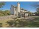 Spacious backyard featuring a stone patio with pergola, perfect for outdoor entertaining at 4950 Luke Dr, Cumming, GA 30040
