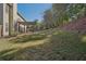 Large backyard with a sloped lawn, offering plenty of space for outdoor activities at 4950 Luke Dr, Cumming, GA 30040