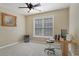 Bedroom with carpet flooring, desk, and a fan at 4950 Luke Dr, Cumming, GA 30040