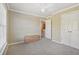 Well-lit, neutral bedroom with a ceiling fan and a traditional wooden chest at 4950 Luke Dr, Cumming, GA 30040