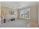 Bright, neutrally decorated bedroom with a large window and elegant vase displaying ornamental grass at 4950 Luke Dr, Cumming, GA 30040