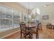 Bright breakfast nook with a round table and large windows, seamlessly connected to the living area for casual dining at 4950 Luke Dr, Cumming, GA 30040