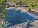A view of the community pool, showcasing the expansive pool deck, a covered pool, and nearby amenities at 4950 Luke Dr, Cumming, GA 30040