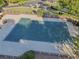 Aerial view of a community pool covered for the off-season, surrounded by a patio at 4950 Luke Dr, Cumming, GA 30040