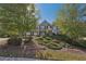 Inviting home with mature trees and landscaping, set on a well-maintained lawn at 4950 Luke Dr, Cumming, GA 30040
