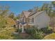 This two-story home has lush greenery and mature trees, enhancing its charm and curb appeal at 4950 Luke Dr, Cumming, GA 30040