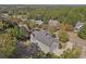 An aerial view captures the home's backyard with trees, offering privacy and natural beauty at 4950 Luke Dr, Cumming, GA 30040