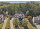 Beautiful two-story home with a well-manicured lawn and a driveway in a peaceful neighborhood at 4950 Luke Dr, Cumming, GA 30040