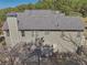 Exterior view of a home with a gray roof, neutral siding, and a backyard patio area at 4950 Luke Dr, Cumming, GA 30040