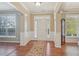 Bright and airy foyer with white trim, hardwood floors, and decorative rug at 4950 Luke Dr, Cumming, GA 30040