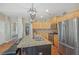Open kitchen featuring island, granite counters and stainless steel refrigerator at 4950 Luke Dr, Cumming, GA 30040