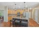 Gourmet kitchen with granite island, seating, stainless appliances, and maple cabinets; ideal for cooking and entertaining at 4950 Luke Dr, Cumming, GA 30040