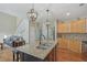 Spacious kitchen with granite island and an open layout with stairs at 4950 Luke Dr, Cumming, GA 30040