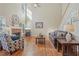 Bright living room with hardwood floors, a fireplace, and soaring vaulted ceilings at 4950 Luke Dr, Cumming, GA 30040
