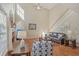 Inviting living room with a fireplace, hardwood floors, and a vaulted ceiling at 4950 Luke Dr, Cumming, GA 30040