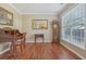 Traditional office with hardwood floors, ornate desk, and large windows at 4950 Luke Dr, Cumming, GA 30040