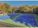 Aerial view of the community tennis courts next to a covered pavilion at 4950 Luke Dr, Cumming, GA 30040