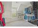 Bright walk-in closet featuring built-in shelving for optimal storage and organization solutions at 4950 Luke Dr, Cumming, GA 30040