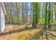 Spacious backyard featuring a wooden fence and mature trees, offering privacy and a natural setting at 2220 Golden Valley Dr, Lawrenceville, GA 30043