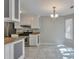Bright eat-in kitchen with stainless steel appliances and adjacent dining area at 2220 Golden Valley Dr, Lawrenceville, GA 30043