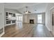 Open concept living room featuring hardwood floors, fireplace, and vaulted ceiling at 2220 Golden Valley Dr, Lawrenceville, GA 30043