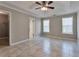 The spacious main bedroom features tiled floors, crown molding, a ceiling fan, and plenty of natural light at 2220 Golden Valley Dr, Lawrenceville, GA 30043