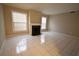 Bright living room with fireplace flanked by windows is perfect for gatherings and relaxation at 37 Le Parc Fontaine, Lithonia, GA 30038