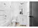 Modern bathroom features white marble, sleek fixtures, tub, and ample natural light at 1930 Collins Hill Rd, Lawrenceville, GA 30043