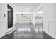 Spacious three-car garage with epoxy flooring, ample lighting, and a clean, organized design for vehicle storage at 1930 Collins Hill Rd, Lawrenceville, GA 30043