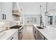 Elegant kitchen with white countertops, stainless steel appliances, and a view to the outdoor scenery at 1930 Collins Hill Rd, Lawrenceville, GA 30043