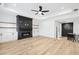 Large living room featuring a fireplace, hardwood floors, and recessed lighting at 1930 Collins Hill Rd, Lawrenceville, GA 30043