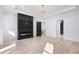 Spacious living room featuring fireplace, custom lighting, and modern floors at 1930 Collins Hill Rd, Lawrenceville, GA 30043