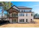 Back of home featuring a patio, balcony and multiple windows at 1930 Collins Hill Rd, Lawrenceville, GA 30043