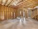 Unfinished basement featuring framed walls, concrete floor, and exposed ceiling at 1930 Collins Hill Rd, Lawrenceville, GA 30043