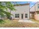 A townhouse backyard featuring a concrete patio, small yard and the home's rear facade at 3045 Hendrick Dr, Mcdonough, GA 30253