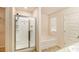 Bright bathroom featuring a shower and separate soaking tub, with a neutral color palette and modern fixtures at 3045 Hendrick Dr, Mcdonough, GA 30253