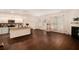 Open-concept living area featuring hardwood floors, fireplace and natural light at 3045 Hendrick Dr, Mcdonough, GA 30253