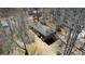 Aerial view of a ranch home nestled among mature trees on a large, private lot at 380 Hidden Valley Sw Dr, Conyers, GA 30094