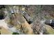 Aerial view of a ranch home nestled among mature trees on a large, private lot at 380 Hidden Valley Sw Dr, Conyers, GA 30094