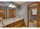 Well-lit bathroom featuring a vanity with sink and an adjacent water closet at 380 Hidden Valley Sw Dr, Conyers, GA 30094