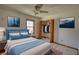 Bedroom features a double bed, ceiling fan, closet, and natural light at 380 Hidden Valley Sw Dr, Conyers, GA 30094