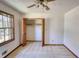 Well-lit bedroom with ceiling fan, closet, carpeting, and natural light from window at 380 Hidden Valley Sw Dr, Conyers, GA 30094