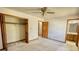 Spacious bedroom with carpeting, ceiling fan, closet, and access to the ensuite bathroom at 380 Hidden Valley Sw Dr, Conyers, GA 30094