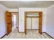 Carpeted bedroom with closet and paneled doors at 380 Hidden Valley Sw Dr, Conyers, GA 30094