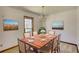 Dining room features a wood table with seating for six and a large window at 380 Hidden Valley Sw Dr, Conyers, GA 30094