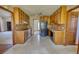 Kitchen boasts ample wood cabinets, classic appliances, and a view into other rooms at 380 Hidden Valley Sw Dr, Conyers, GA 30094