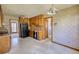 Well-lit kitchen with wood cabinets, standard appliances, and a view into other rooms at 380 Hidden Valley Sw Dr, Conyers, GA 30094