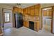 Functional kitchen featuring wood cabinetry and appliances with views to other areas at 380 Hidden Valley Sw Dr, Conyers, GA 30094